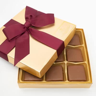 Gold box of Aunt Aggie De's Chocolate Pecan Toffee